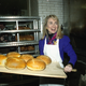 Hillary Rodham Clinton, wife of Democratic presidential hopeful BIll Clinton, removes several loaves of fresh bread from the oven of Panetteria Bakery in the Bronx borough of New York, April 3, 1992. Mrs. Clinton is campaigning in New York for her husband as the candidates prepare for New York's primary.